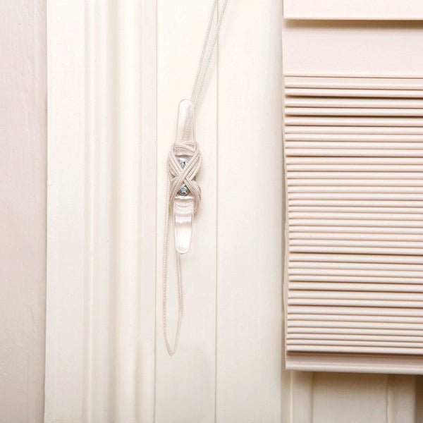 Envolturas de cordón para persianas de plástico transparente Dreambaby de 0,5 pulgadas de ancho.