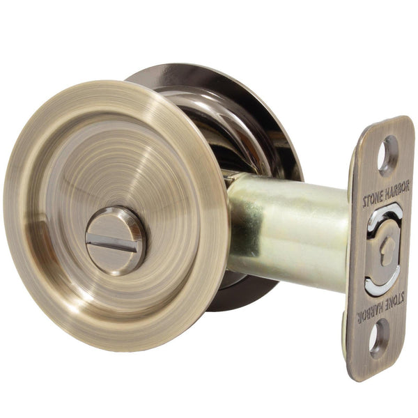 Round Pocket Door Lock, Privacy (Bed/Bath) Latch, 2-3/8" Backset, RCL, Antique Brass by Stone Harbor Hardware