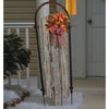 Celebrations  Clear  48 in. Yard Decor  Faux Wood Sleigh with Bow and Garland